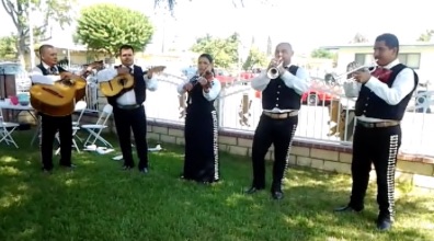 Mariachi Oro y Plata performing at a backyard birthday event Mariachi Oro y Plata